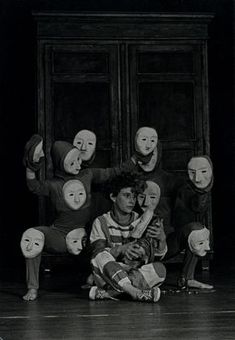 a group of people with masks on their faces