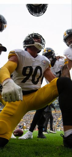 a football player sitting on the ground during a game