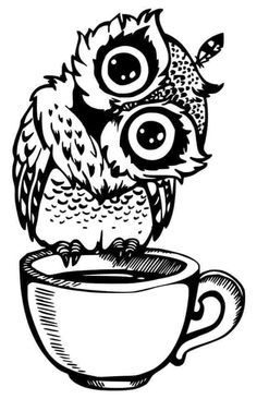 an owl sitting on top of a coffee cup