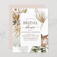 an elegant wedding card with tropical leaves and flowers