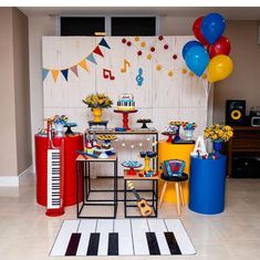 a birthday party with balloons, cake and decorations