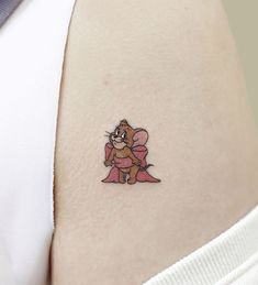 a small tattoo on the back of a woman's stomach