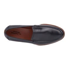 The Griffith loafer features an exquisite design with a stunning brogue detailing on the tongue and a classic slip-on style. Perfect for adding sophistication to any ensemble, the Griffith blends timeless elegance with ease of wear. Whether for a formal occasion or everyday functionality, these loafers ensure you look polished and refined with every step. Classic Black Slip-on Tassel Loafers, Classic Black Plain Toe Slip-ons, Masculine Moc Toe Slip-ons For Formal Occasions, Classic Slip-on Boat Shoes With Stitched Sole, Classic Wingtip Slip-ons With Brogue Detailing, Classic Black Slip-ons With Brogue Detailing, Classic Black Slip-ons With Stitched Sole, Classic Wingtip Slip-ons With Rubber Sole, Classic Wingtip Slip-ons For Work