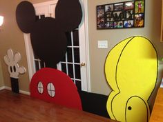 the mickey mouse and donald mouse heads are on display in front of the kitchen door