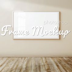 a frame mock up on the wall in an empty room with wood floor and white walls