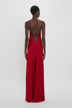 This 1990s-inspired camisole-slip dress has a bias cut for a flattering fit. A deep-V and scooped back create a sensuous silhouette, while delicate spaghetti strap detailing adds a sexy playfulness. With its floor-pooling hemline and confident shade of Poppy Red, it makes an assured statement. Victoria Beckham Low Back Cami Floor-Length Dress In Poppy Red  - Size 12 UK Red Silk Maxi Dress, Red Simple Dress, Long Red Dress Formal, Tailor Clothes, Prom Dress Uk, Simple Formal Dresses, Simple Red Dress, Simple Formal Dress, Red Flowy Dress