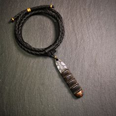 ❤This unique Ladder pendant is made by Tibetan craftsmen in Hepo Township, Baiyu County.It is made of cold iron and copper, black color,the shape is Tibetan Ladder of Heaven,length is 60mm.You can make it into a pendant,keychain, or just put it on your desk,as an ornament.❤Details 100% Handmade Pendant material:cold iron,copper Pattern: Ladder Length: 60mm /2.36 inches Width: 12mm /0.47 inches ❤Free Gift : Black Cowhide Cord Length:68cm / 26.8inches Width:4mm / 0.16inch You'll get 1 × ladder amu Handmade Black Brass Necklace, Artisan Black Brass Jewelry, Black Brass Amulet Jewelry, Black Brass Pendant Necklace, Black Pendant Jewelry With Waxed Cord, Black Waxed Cord Pendant Jewelry, Artisan Black Brass Necklaces, Black Brass Artisan Necklace, Artisan Black Brass Necklace