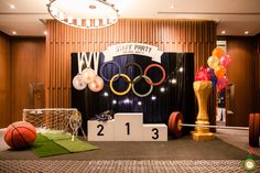 an olympic themed party with balloons and decorations