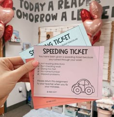 someone is holding up two tickets for the speed driving ticket contest on valentine's day