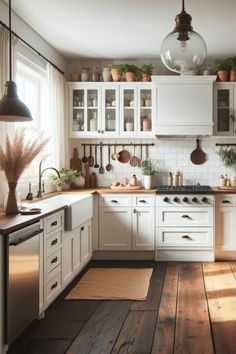 a kitchen with white cabinets and wooden floors