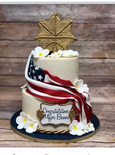 a cake decorated with an american flag and flowers