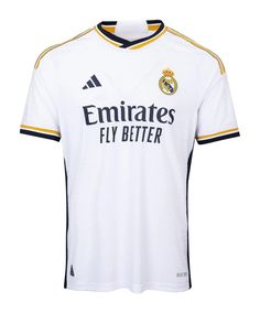 the real madrid jersey is white with black trims and gold detailing on the chest