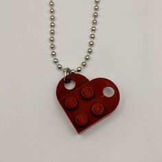 Handmade necklace made from genuine LEGO [Dark Red] plates and a 24" nickel plated ball chain. May have imperfections. Personalized Red Stainless Steel Jewelry, Red Chain Charm Necklace For Gift, Red Nickel-free Pendant Necklace, Red Stainless Steel Pendant Jewelry, Handmade Metal Dog Tag Necklace, Red Pendant Necklace With Chain, Red Stainless Steel Necklace With Adjustable Chain, Red Metal Charm Necklace With Adjustable Chain, Nickel-free Red Metal Necklace