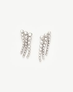 Beaded Waterfall Drop Earrings | Sterling Silver. These Statement Silver Waterfall-Style Silver Studs Feature Rounded Beads that Graduate in Size. Let Them Take Centre Stage as they Move and Flow in Your Ear Stack, or Team with Pavé Studs. Metal: Rhodium Plating on Recycled Sterling Silver Dimensions: 27. 5mm X 13. 3mm Weight: 8. 6g Product Code: Gu-S-E14-Ns Tennis Jewelry, Necklace Length Guide, Silver Diamond Necklace, Trending Necklaces, Ear Stack, Solid Gold Necklace, Mixed Metal Jewelry, Centre Stage, Engraved Jewelry