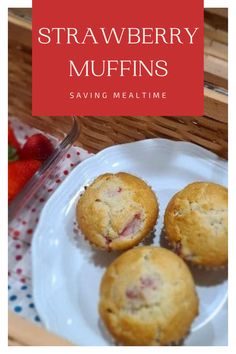 strawberry muffins on a white plate next to strawberries