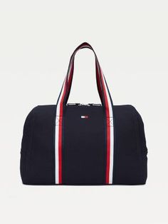 Tommy Hilfiger Womens Bag. Practicality And Standout Style Come Together In This Spacious Zip Tote, Showcasing Our Signature Stripes At The Handles For A Branded Finish. Everyday Tommy Hilfiger Bag With Zipper Closure, Tommy Hilfiger Travel Bags With Zipper Closure, Sporty Canvas Bags For On-the-go, Sporty Cotton Bags For Daily Use, Sporty Rectangular Cotton Bag, Sporty Canvas Gym Bag, Navy Sporty Bag With Zipper Closure, Sporty Navy Bag With Zipper Closure, Sporty Rectangular Canvas Bag