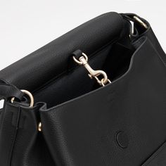 Designed to move. A trusted classic for on-the-go comfort. Small Leather Accessories, Leather Industry, Small Pouch, Black Leather Backpack, Backpack Travel Bag, Zippered Tote, Small Pouches, Travel Jewelry, Mini Tote