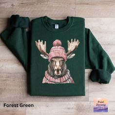 🦌 Rock this cozy moose sweatshirt! Perfect for winter vibes ❄️ and keeping warm in style. A fun and cute top for chilly days 🥶, makes a great unique gift! 🎁  Gildan 18000 Sweatshirt: A sturdy and warm sweatshirt bound to keep you warm in the colder months. A pre-shrunk, classic fit sweater that's made with air-jet spun yarn for a soft feel and reduced pilling. * 50% cotton, 50% polyester * Pre-shrunk * Classic fit with no center crease * 1x1 athletic rib knit collar with spandex * Air-jet spu Outfit For Cold Days, Comfy Outfit, Winter Animals, Winter Vibes, Sweatshirt Cute, Warm Sweaters, Cute Sweaters, Fitted Sweater, Knit Collar