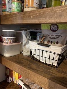 the shelves in this pantry are filled with food