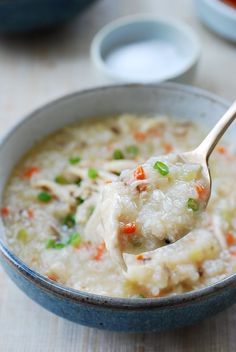 a spoon full of soup with meat and vegetables