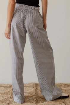 Stay comfortable and stylish with our Pilar Striped Lounge Pants. With a relaxed fit and high waist, these straight leg pants provide both comfort and a flattering silhouette. The elastic waistband and adjustable robe belt ensure the perfect fit for all-day wear. Elevate your loungewear game with these versatile and chic pants. Relaxed Fit Color: White/Blue Stripe Elastic Waistline w/ Adjustable Rope belt High Waist 2 Side Pockets Straight Leg 100% Polyester Relaxed Fit Straight Leg Casual Pants, Relaxed Fit Straight Leg Pants For Daywear, Relaxed Fit High Waist Bottoms For Daywear, Relaxed Straight Leg Pants For Daywear, Relaxed Straight Leg Work Pants, High Waist Relaxed Cotton Pants, Relaxed High Waist Cotton Pants, Relaxed Wide Leg Pants With Elastic Waistband For Work, Straight Leg Bottoms With Belt Loops For Daywear