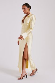 More than a statement, it’s a declaration.This is a long-sleeved maxi dress with a deep collared neckline and centre front button detail. The sleeves end in lined, flared cuffs and the skirt ends in a clean-cut hem with a centre side hem split. The waist is lightly cinched to create a loose hourglass silhouette, further complemented by the soft draped MESHKI blend fabrication. Elegant in its simplicity, this dress is the perfect choice for quick glam.