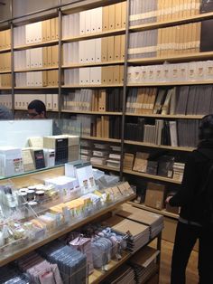 two people looking at items in a book store