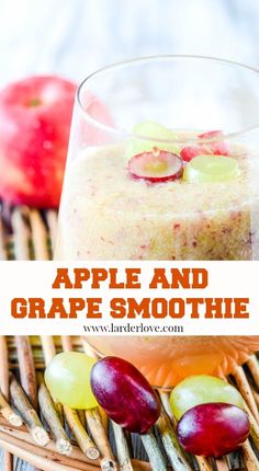 an apple and grape smoothie in a glass on a wicker basket