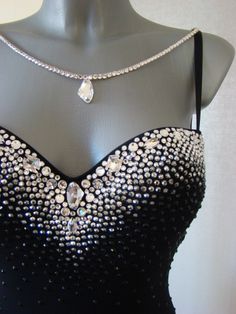 a black dress with crystal stones on it