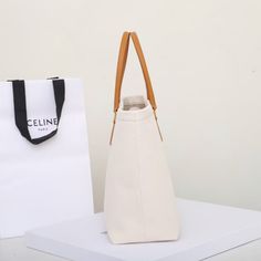 Size: 44cm*32cm*6cm It comes with Dust box, Care manual, Tag, and Paper bag. White Canvas Shopping Bag With Top Carry Handle, Large Beige Satchel With Top Carry Handle, Modern Canvas Bag With Handles, Cream Square Shoulder Bag With Dust Bag, Large Modern Box Bag With Handles, Modern Large Box Bag, Canvas Top Handle Box Bag For Shopping, Rectangular Box Bag With Leather Handles For Shopping, Large Capacity Canvas Shopping Bag