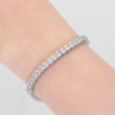 If you’ve ever dreamed of wearing an expensive Tennis Bracelet, but could not afford it; here is your Limited Time opportunity! You see, the Real Diamond Tennis Bracelets have this Safety Chain, that in case it's safety Lock fails; they won't lose a $10,000 investment. With that in mind, we applied the same principle to our Zirconite Tennis Bracelet. Now the Bracelet comes with a Safety chain. It simply completes the picture! No one will ever suspect that Bracelet you're wearing is a Fake! Rhodi Classic White Gold Cubic Zirconia Crystal Bracelet, Classic White Gold Crystal Bracelet With Cubic Zirconia, Classic White Cubic Zirconia Crystal Bracelet, Classic White Cubic Zirconia Bracelet, Formal White Cubic Zirconia Chain Bracelet, White Cubic Zirconia Chain Bracelet For Formal Occasions, Classic Crystal Bracelets For Anniversary, Classic Cubic Zirconia Bracelets With Sparkling Stones, Classic Crystal Tennis Bracelet As Gift