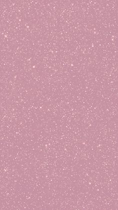 a pink background with white speckles on it