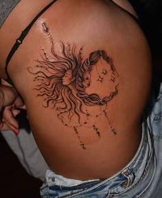 a woman's back with a tattoo design on her stomach and the image of a horse