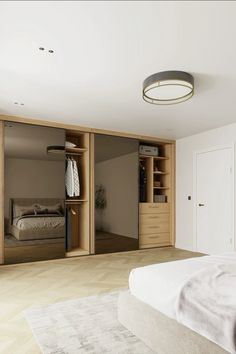 an empty bedroom with closets and a bed