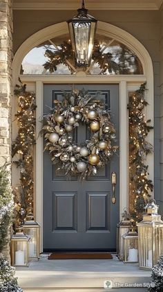 a front door decorated with christmas decorations and lights