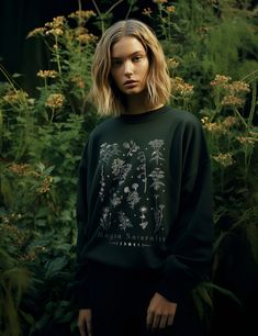 Wrap yourself in comfort and embrace the power of nature with our irresistibly soft and warm Magia Naturalis (Nature Magic) sweatshirt. Designed for green witches and plant mystics, this sweater seamlessly blends herbology with modern comfort. Made from 50% cotton and 50% polyester, it provides a cozy and breathable experience. Elevate your everyday style and connect with nature through this unique addition to your wardrobe staples. Also makes the perfect gift for any plant lover in your life. C Botanical Relaxed Fit Tops For Fall, Botanical Style Cotton Sweatshirt For Fall, Green Witch Aesthetic Fashion, Witchy Botanical, Witch Aesthetic Fashion, Green Witch Aesthetic, Nature Magic, Natural Magic, Connect With Nature