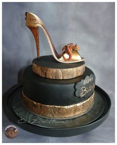 a birthday cake with a high heel shoe on top