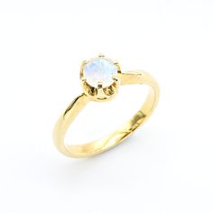 Gold Moonstone Ring set with a Natural Rainbow Moonstone - diamond cut & rainbow interchanging color, at 5mm, 0.6 Carat. Band width 2.3mm. Gold Solitaire Ring design made of Gold Vermeil ☞ 18k Gold Plating on top of Solid 925 Sterling Silver. Click here for ☞ Matching EarringsMatching Pendant - please ask me Details:♥ Natural Rainbow Moonstone sourced from Madagascar♥ Moonstone: 5mm, 0.6 Ct, diamond cut♥ Band width ≈ 2.3mm, thickness ≈ 1.2mm♥ 18K Gold Vermeil❀ Each Natural Gem is unique & will h Solitaire Ring Designs, Gold Moonstone Ring, June Birthstone Ring, Gold Solitaire Ring, Moonstone Earrings, June Birthstone, Natural Rainbow, Moonstone Ring, June Birth Stone