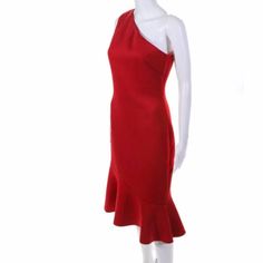 a mannequin wearing a red dress with one shoulder and an asymmetrical neckline