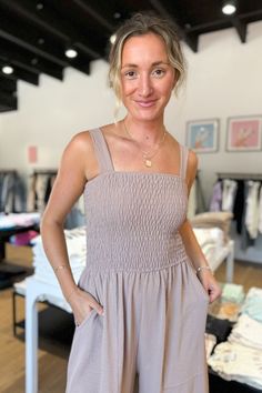 The Sleeveless Smock Wide Leg Jumpsuit gives you an oversized look that flatters your figure, while the smocked top ensures a comfy fit. With its flowy design, the bottom has a loose, long fit, but might need some hemming or to be worn with heels for shorter inseams. Or, you can rock a longer hemline for a chic and on-trend style. Model is 5'10" and wearing a size Small. Sleeveless Sweater Cardigan, Maxi Romper, Flowy Design, Smocked Top, Blouse Sleeveless, Trend Style, Rock A, Little White Dresses, Sleeveless Sweater