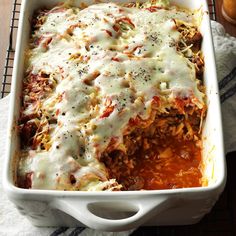 a casserole dish filled with meat and cheese