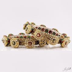 These Rajasthani openable bangles are beautifully designed with gold plating and adorned with delicate pearls. Perfect for any special occasion, they add a touch of elegance and ethnic charm to any outfit. Elevate your style with these stunning bangles. Color choices: - White - Multicolor / Rainbow White Bollywood Bracelets With Intricate Design, Traditional Jeweled Bracelets For Celebration, Bollywood Style Festive White Bangle, Ceremonial White Bangle For Diwali, White Ceremonial Bangle For Festivals, Ceremonial White Bangle For Festivals, Bollywood White Bangle For Diwali, White Meenakari Bangle For Diwali, Bollywood Style White Bangle For Diwali