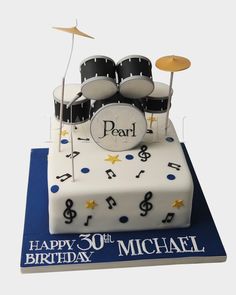 a birthday cake with musical instruments on it