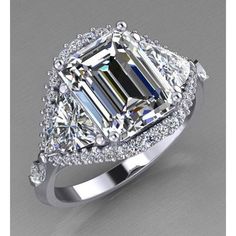 an emerald cut diamond ring with diamonds around it