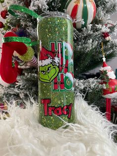 the grinch christmas tree is decorated with green glitter