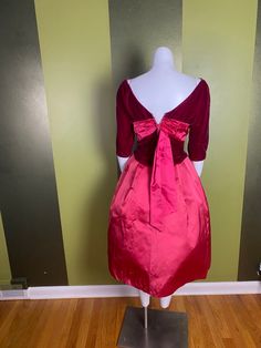 "Gorgeous velvet and satin Kay Selig gown with bubble skirt. Color is hard to capture: I'd call it a deep raspberry color. Stiff skirt, lined with heavy interfacing. Velvet on one shoulder has a small pressed spot. I have not tried steaming to get wrinkles out Women's xs 34\" bust 24\" waist Skirt length: 27\"" Vintage Velvet Wedding Dress, Fitted Ball Gown Dress With Satin Bow, Vintage Satin Evening Dress, Vintage Dress With Pleated Bodice For Gala, Vintage Satin Cocktail Dress, Pink Silk Dress For Vintage Events, Vintage Satin Dress For Gala, Vintage Red Skirt For Party, Vintage Taffeta Ball Gown Dress