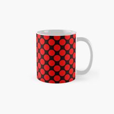 a red and black polka dot pattern on a coffee mug