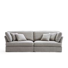 a gray couch with pillows on it