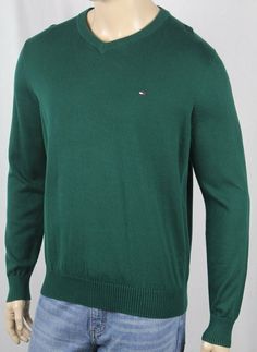 Tommy Hilfiger Green V Neck Cotton Long Sleeve Sweater NWT ~*~*Tommy Hilfiger*~*~ ~*~*New With Tags*~*~ This gorgeous crew neck sweater is by Tommy Hilfiger. In a fabulous Green 100% cotton, this sweater features a handsome v neck neckline. The sleeves are long and have ribbed cuffs. A Tommy Hilfiger Logo is embroidered on the chest,  and finishes this sweater off quite nicely.   Small Medium Large X-Large XX-Large ARMPIT TO ARMPIT 20.5" (52.1 cm) 22” (55.9 cm) 23.5” (59.7 cm) 25” (63.5 cm) 27” White Tommy Hilfiger Cotton Sweater, Tommy Hilfiger Sporty Cotton Sweatshirt, Tommy Hilfiger Cotton Crew Neck Sweater, Tommy Hilfiger V-neck Tops, Tommy Hilfiger Crew Neck T-shirt With Logo, Tommy Hilfiger Logo, Sleeve Sweater, Crew Neck Sweater, Neck Sweater