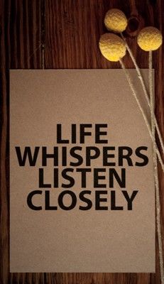 the words life whispers listen closely written in black